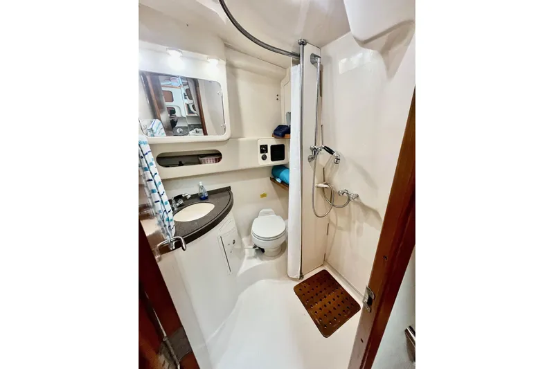  Yacht Photos Pics 2005 Grady-White Express 360 boat bathroom with shower, sink, and toilet.