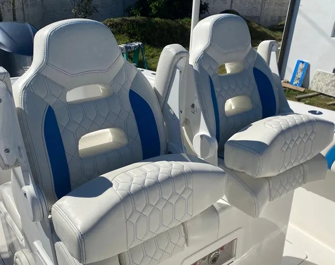  Yacht Photos Pics Luxury white and blue boat seats on a 2019 Sea Tech 33 model.