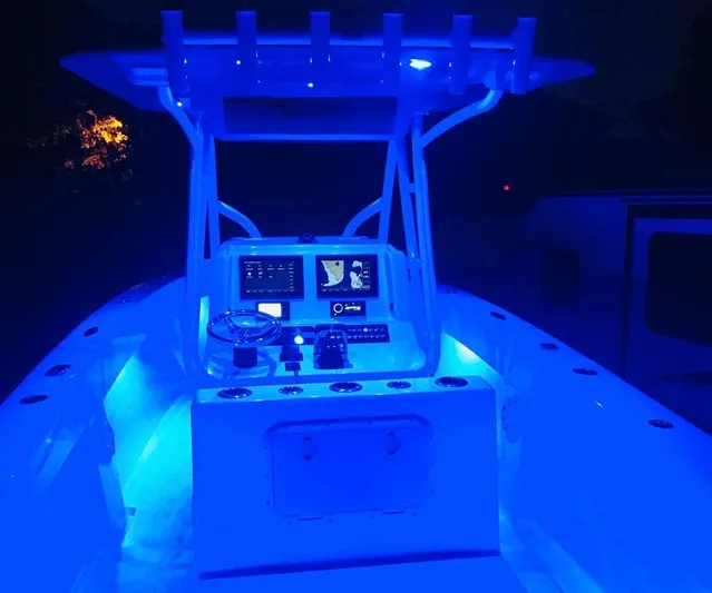  Yacht Photos Pics 2019 Sea Tech 33 boat cockpit illuminated with blue LED lights at night.