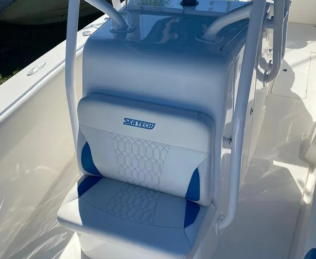  Yacht Photos Pics 2019 Sea Tech 33 boat seat with blue and white upholstery.