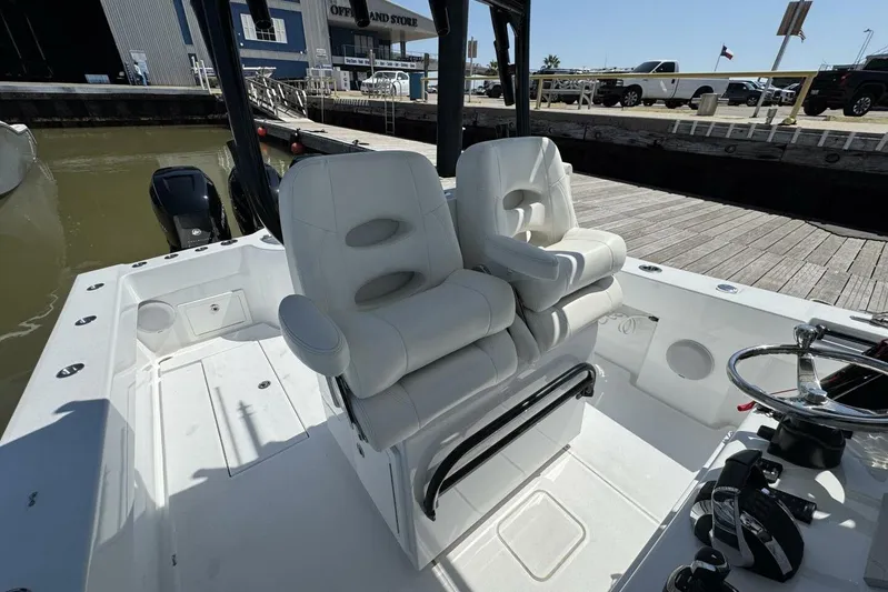  Yacht Photos Pics 2022 Onslow Bay 33 TE boat interior with white seating and steering wheel.