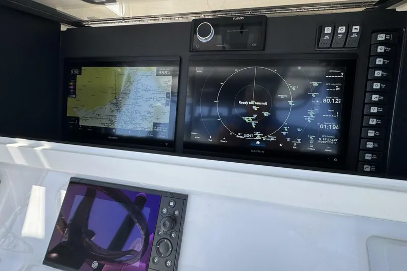  Yacht Photos Pics 2022 Onslow Bay 33 TE boat dashboard with Garmin navigation displays.