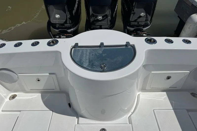  Yacht Photos Pics 2022 Onslow Bay 33 TE boat deck with storage compartments and Mercury engines.