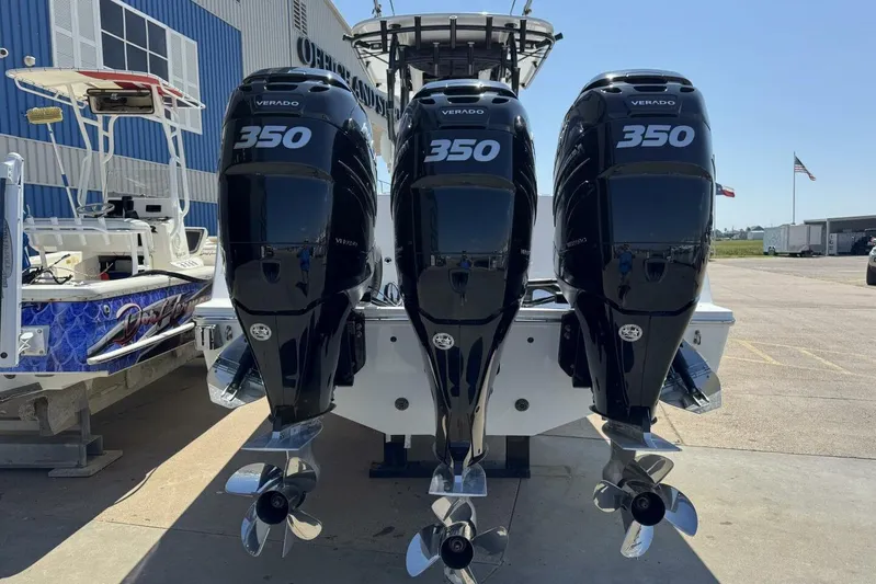  Yacht Photos Pics 2022 Onslow Bay 33 TE boat with triple 350 Verado engines at a marina.