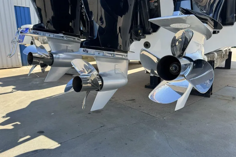  Yacht Photos Pics Twin propellers of a 2022 Onslow Bay 33 TE boat on display.