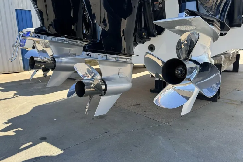  Yacht Photos Pics 2022 Onslow Bay 33 TE boat propellers on display in a marina setting.