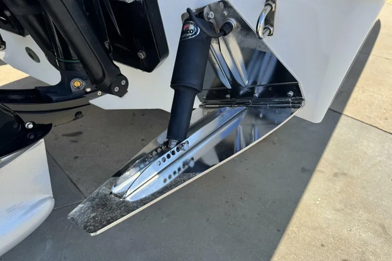  Yacht Photos Pics Trim tab of a 2022 Onslow Bay 33 TE boat, reflecting sunlight.