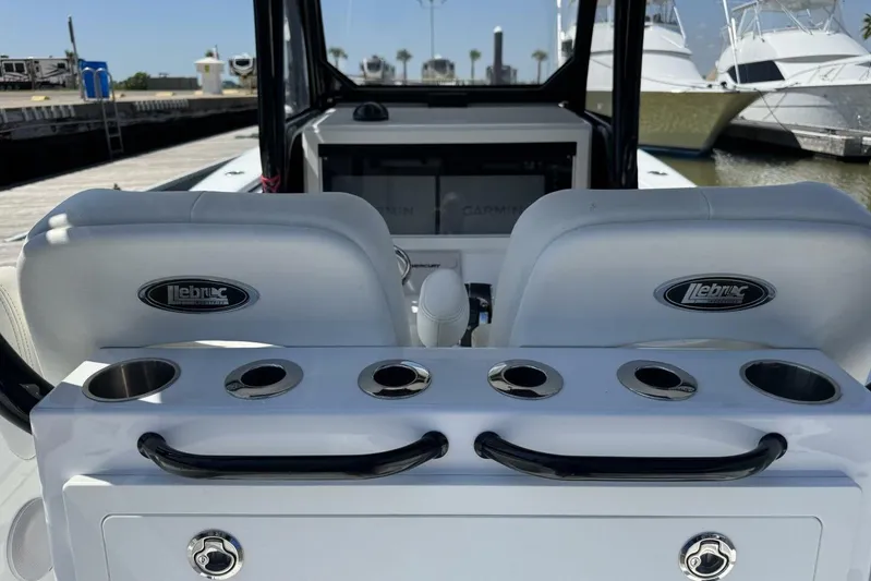  Yacht Photos Pics 2022 Onslow Bay 33 TE boat interior with Lebroc seating and cup holders at a marina.