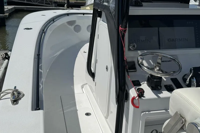  Yacht Photos Pics 2022 Onslow Bay 33 TE boat interior with Garmin displays and Mercury steering wheel.