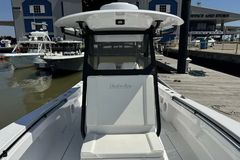  Yacht Photos Pics 2022 Onslow Bay 33 TE boat docked at marina, showcasing sleek design and spacious seating.