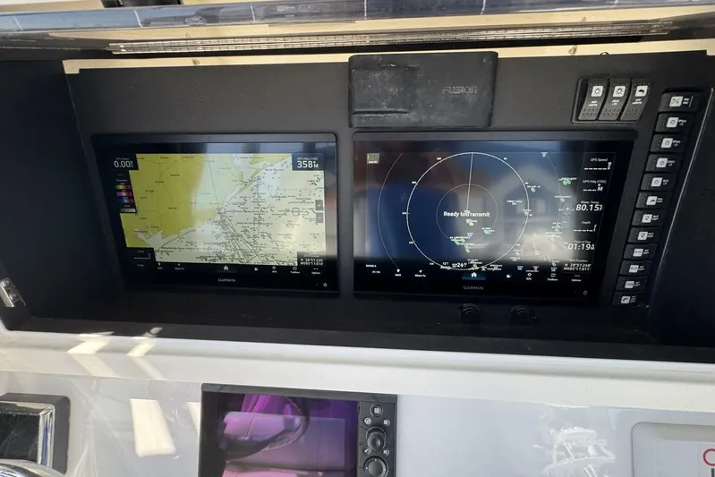  Yacht Photos Pics 2022 Onslow Bay 33 TE boat dashboard with dual Garmin navigation screens.