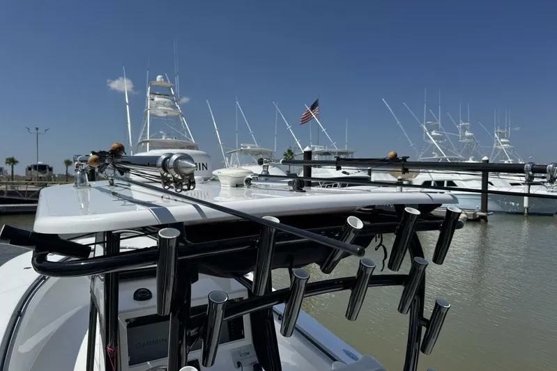  Yacht Photos Pics 2022 Onslow Bay 33 TE boat with fishing rods docked at marina.