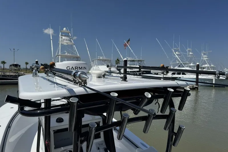  Yacht Photos Pics 2022 Onslow Bay 33 TE boat with fishing rods and Garmin equipment at marina.