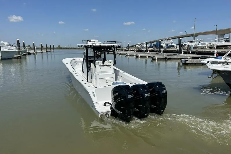  Yacht Photos Pics 2022 Onslow Bay 33 TE boat with triple 350 engines in a marina.