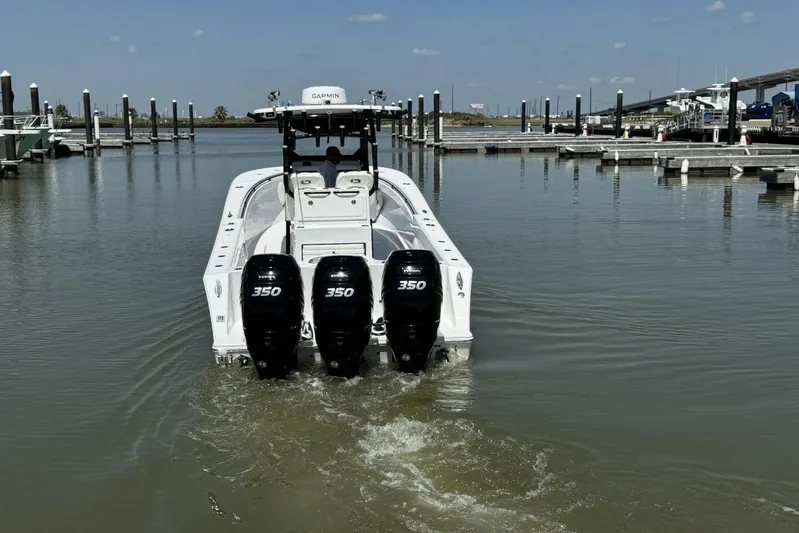  Yacht Photos Pics 2022 Onslow Bay 33 TE boat with triple 350 engines in a marina setting.