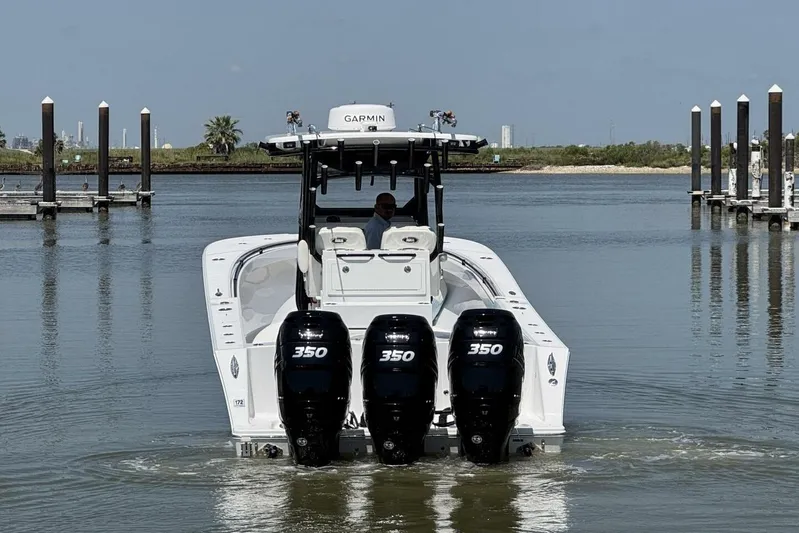  Yacht Photos Pics 2022 Onslow Bay 33 TE boat with triple 350 engines in a marina setting.