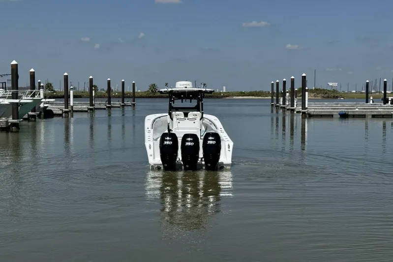  Yacht Photos Pics 2022 Onslow Bay 33 TE boat with triple 350 engines at marina dock.