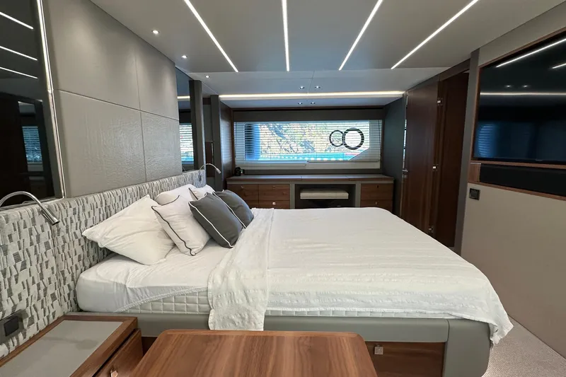 Enough Yacht Photos Pics Luxurious bedroom interior of 2023 Sunseeker 76 Yacht with modern design and elegant furnishings.