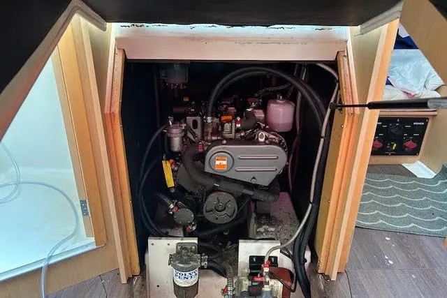 Hummingbird Yacht Photos Pics Engine compartment of a 2017 Beneteau Oceanis 38.1 sailboat, showcasing mechanical components.