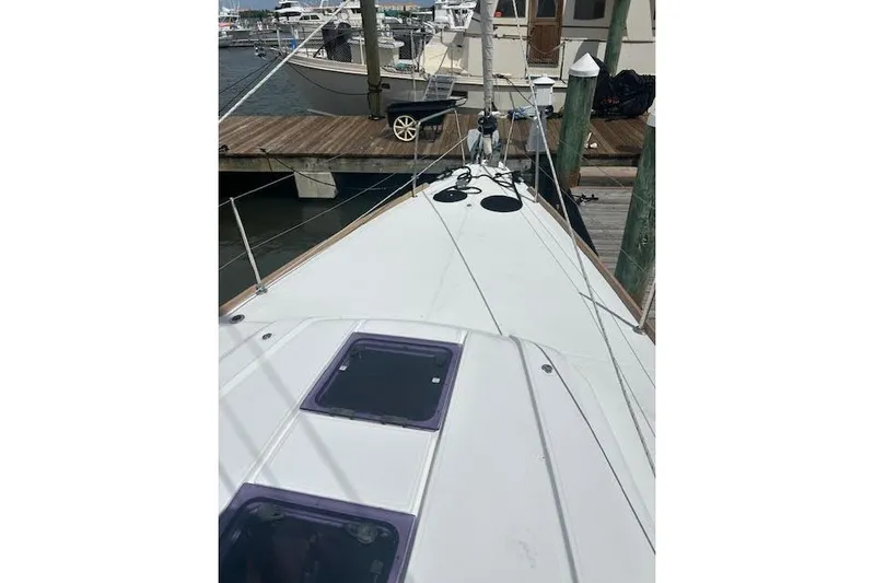 Hummingbird Yacht Photos Pics 2017 Beneteau Oceanis 38.1 sailboat docked at marina, view of deck and rigging.