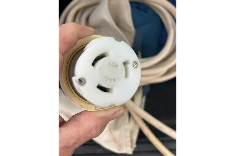 Hummingbird Yacht Photos Pics Close-up of a plug connector on a 2017 Beneteau Oceanis 38.1 sailboat.