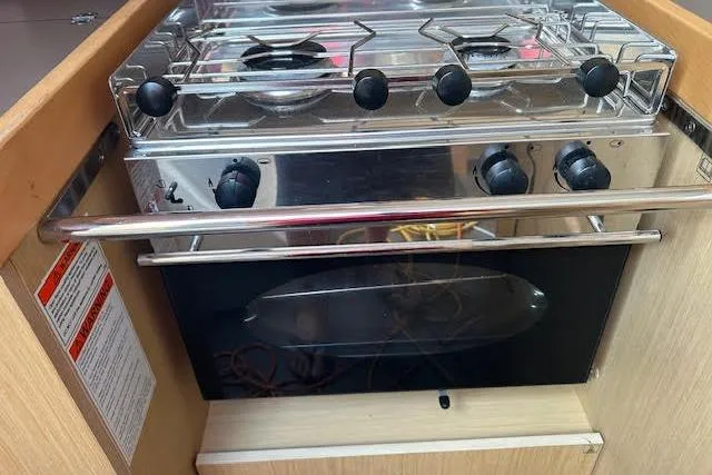 Hummingbird Yacht Photos Pics Stainless steel stove and oven in 2017 Beneteau Oceanis 38.1 yacht kitchen.