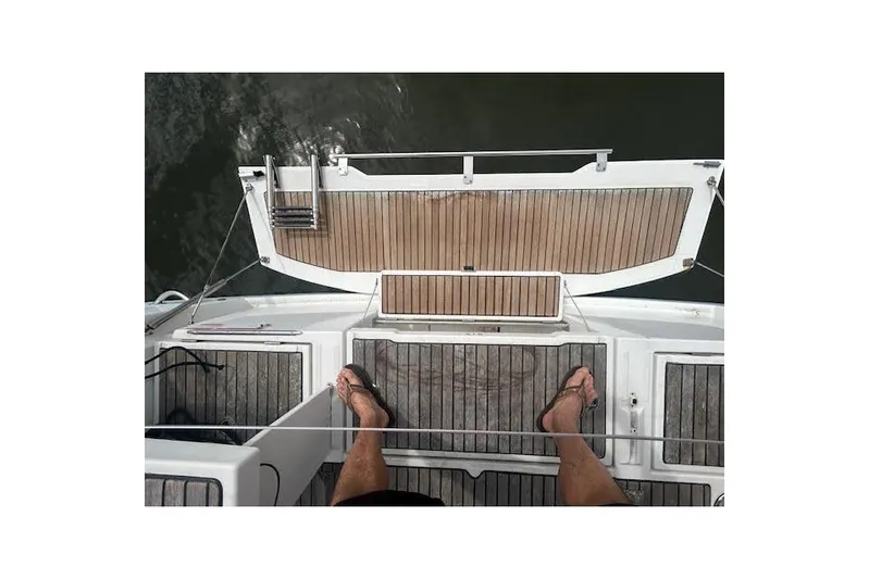 Hummingbird Yacht Photos Pics 2017 Beneteau Oceanis 38.1 yacht deck with teak flooring and water view.