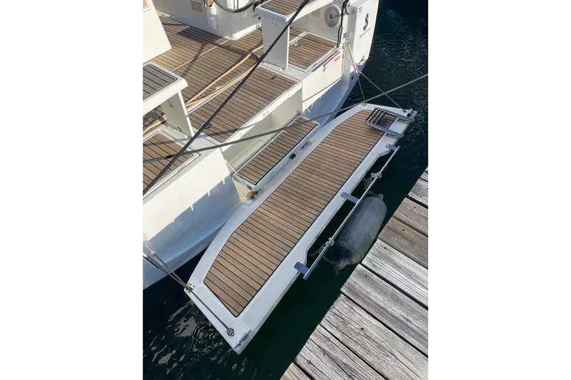Hummingbird Yacht Photos Pics Beneteau Oceanis 38.1 (2017) yacht with teak swim platform at dock.