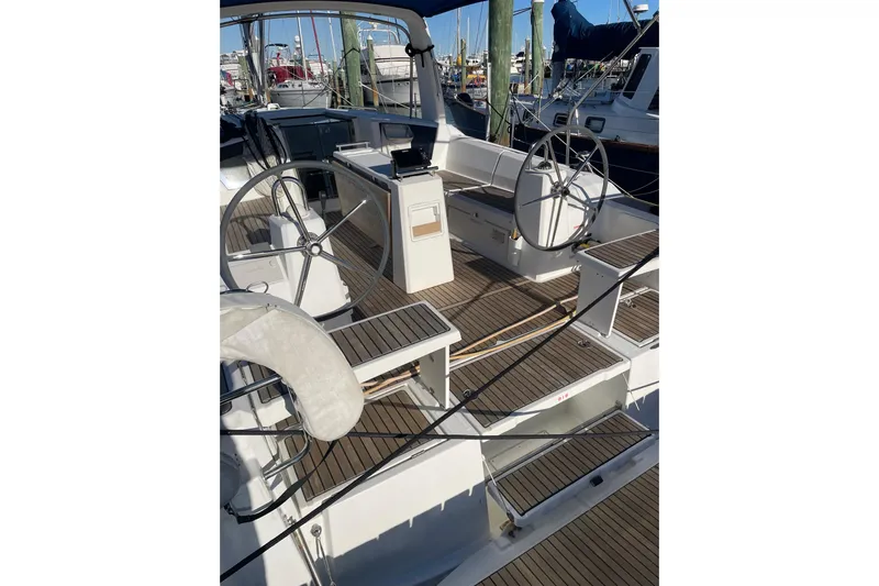 Hummingbird Yacht Photos Pics 2017 Beneteau Oceanis 38.1 sailboat cockpit with dual steering wheels and teak decking.