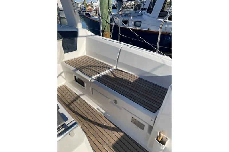 Hummingbird Yacht Photos Pics 2017 Beneteau Oceanis 38.1 yacht cockpit with teak seating and marina view.