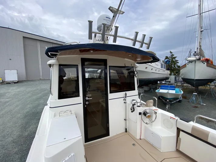  Yacht Photos Pics 2017 Cutwater C-28 boat docked, showcasing rear deck and cabin entrance.