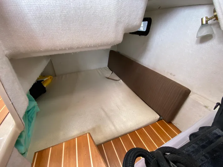  Yacht Photos Pics 2017 Cutwater C-28 cabin interior with wooden flooring and cushioned seating area.