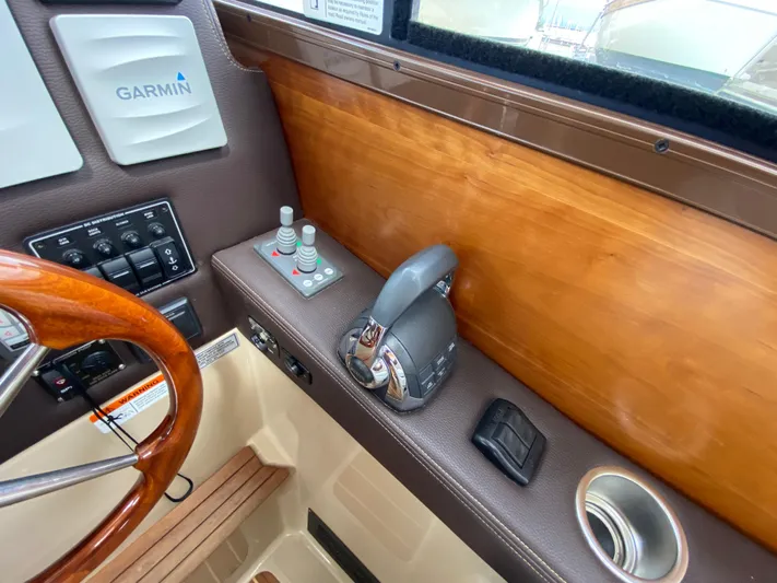  Yacht Photos Pics 2017 Cutwater C-28 helm with Garmin controls and wooden accents.