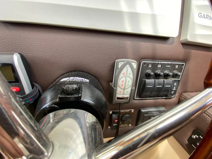  Yacht Photos Pics Control panel of a 2017 Cutwater C-28 boat with various switches and instruments.