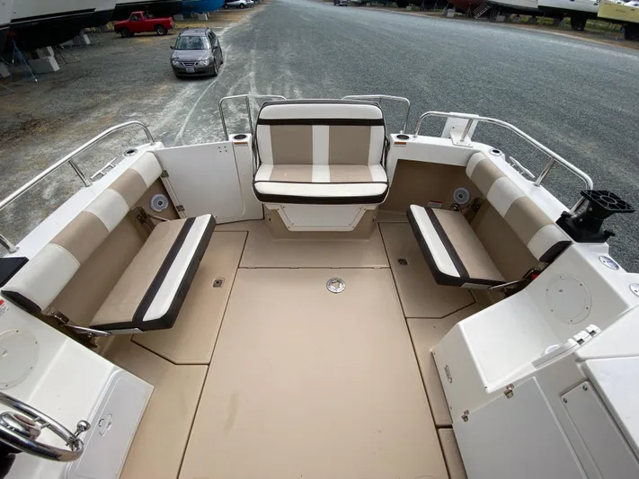  Yacht Photos Pics 2017 Cutwater C-28 boat interior with beige seating and spacious deck area.