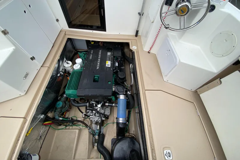  Yacht Photos Pics Engine compartment of a 2017 Cutwater C-28 boat, showcasing detailed mechanical components.