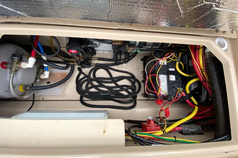  Yacht Photos Pics Engine compartment of a 2017 Cutwater C-28 boat, featuring wiring and components.