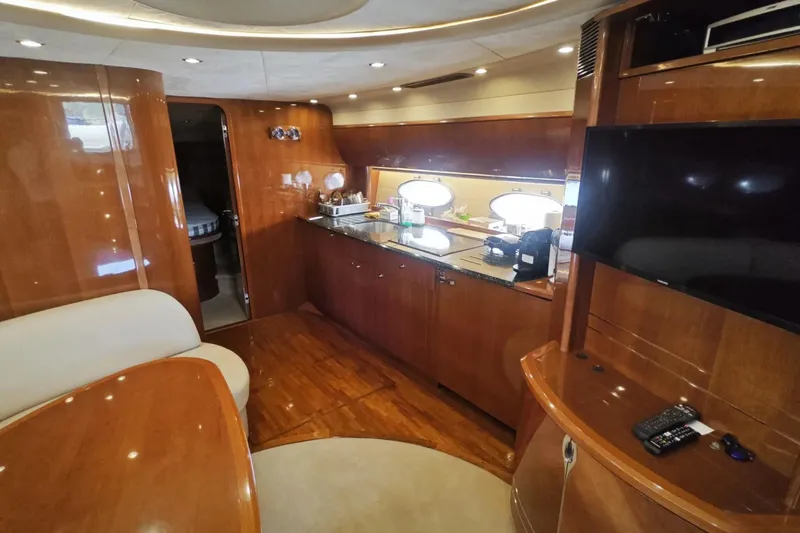  Yacht Photos Pics Luxurious interior of 2009 Princess V58 yacht with wood finishes and modern amenities.
