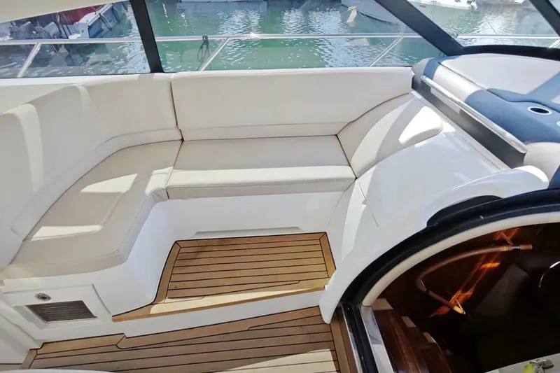 Yacht Photos Pics Luxurious seating area on a 2009 Princess V58 yacht with wooden flooring.