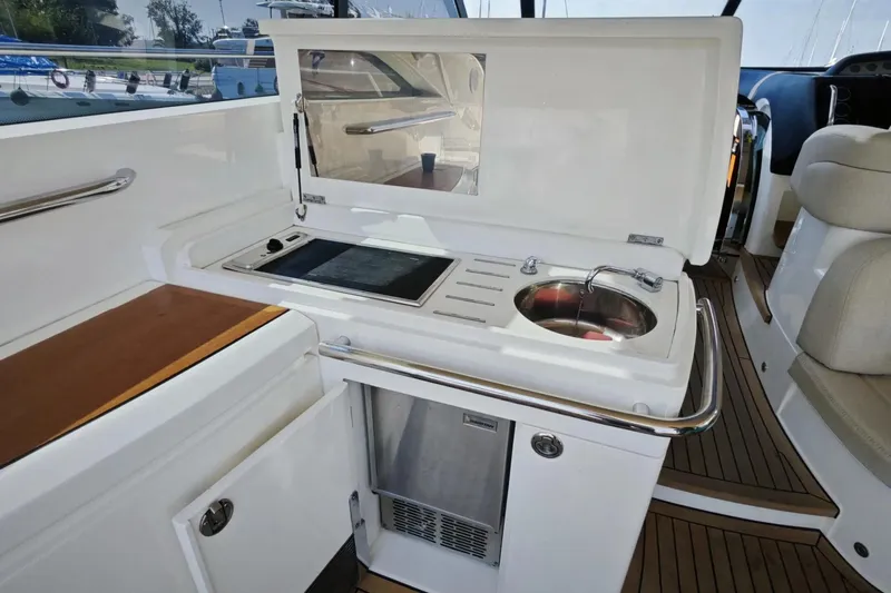  Yacht Photos Pics Luxury yacht galley on 2009 Princess V58 with sink and cooktop.