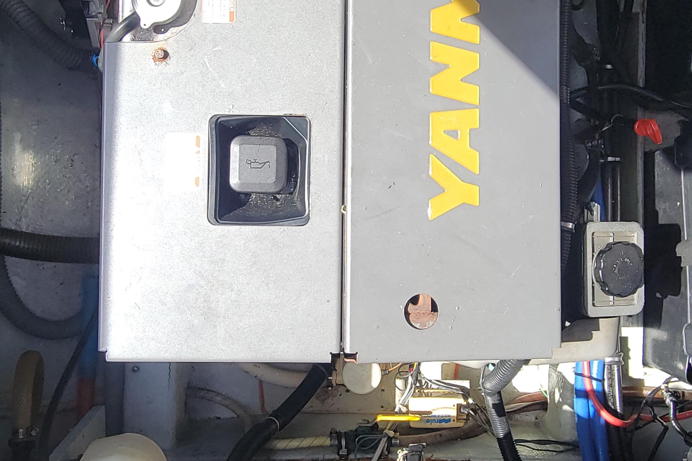 Engine compartment of a 1997 Skipjack 262 Flybridge boat with Yanmar engine.