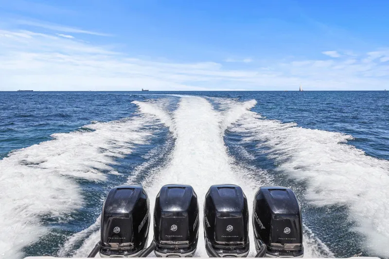 Yacht Photos Pics 2013 Invincible 42 Open Fisherman with four engines cruising on open sea.