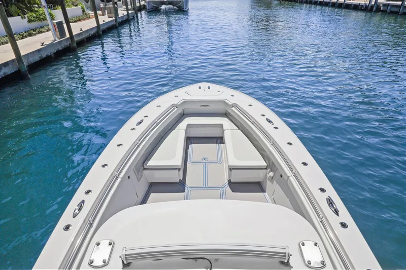  Yacht Photos Pics 2013 Invincible 42 Open Fisherman boat on clear blue water.