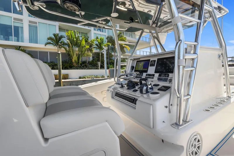  Yacht Photos Pics 2013 Invincible 42 Open Fisherman boat cockpit with modern controls and seating.