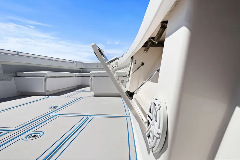  Yacht Photos Pics 2013 Invincible 42 Open Fisherman boat deck with seating and storage compartments.