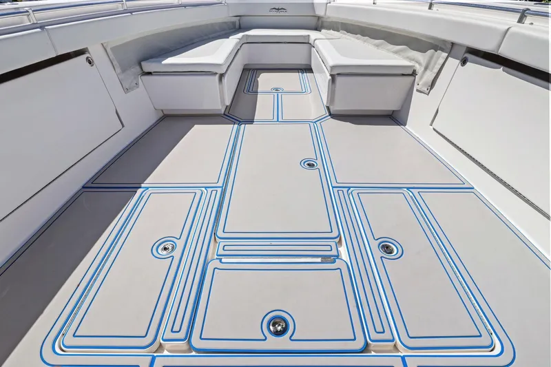  Yacht Photos Pics 2013 Invincible 42 Open Fisherman boat deck with cushioned seating and sleek design.