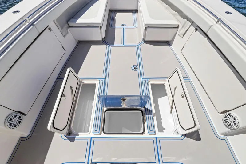  Yacht Photos Pics 2013 Invincible 42 Open Fisherman boat deck with storage compartments open.