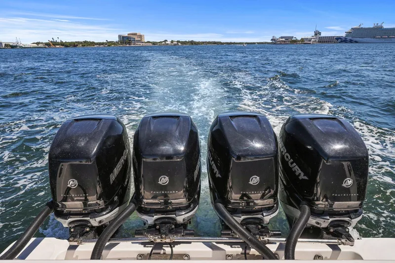  Yacht Photos Pics Four Mercury outboard engines on a 2013 Invincible 42 Open Fisherman boat in open water.