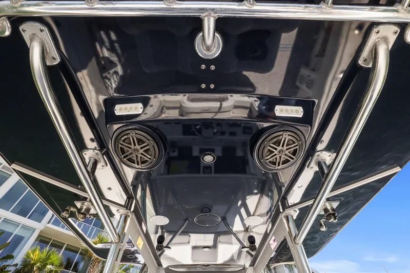  Yacht Photos Pics 2013 Invincible 42 Open Fisherman boat, featuring speakers and lights on the overhead console.