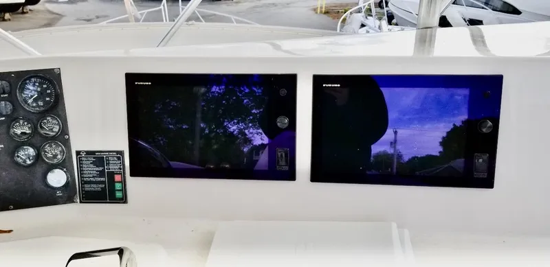 Irish Mist Yacht Photos Pics Boat dashboard with dual screens and gauges, Post 50 Convertible, 2001 model.